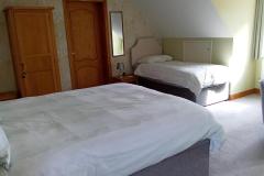 Large bedroom with double bed and single bed
